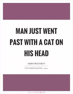 Man just went past with a cat on his head Picture Quote #1